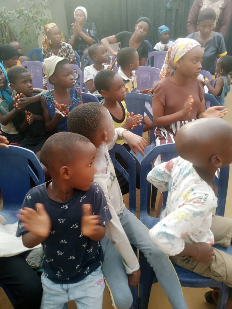 Children worshipping and clapping with joy during the programme