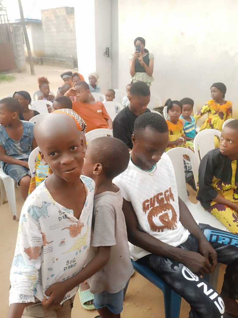 Children seated and welcomed during the outreach